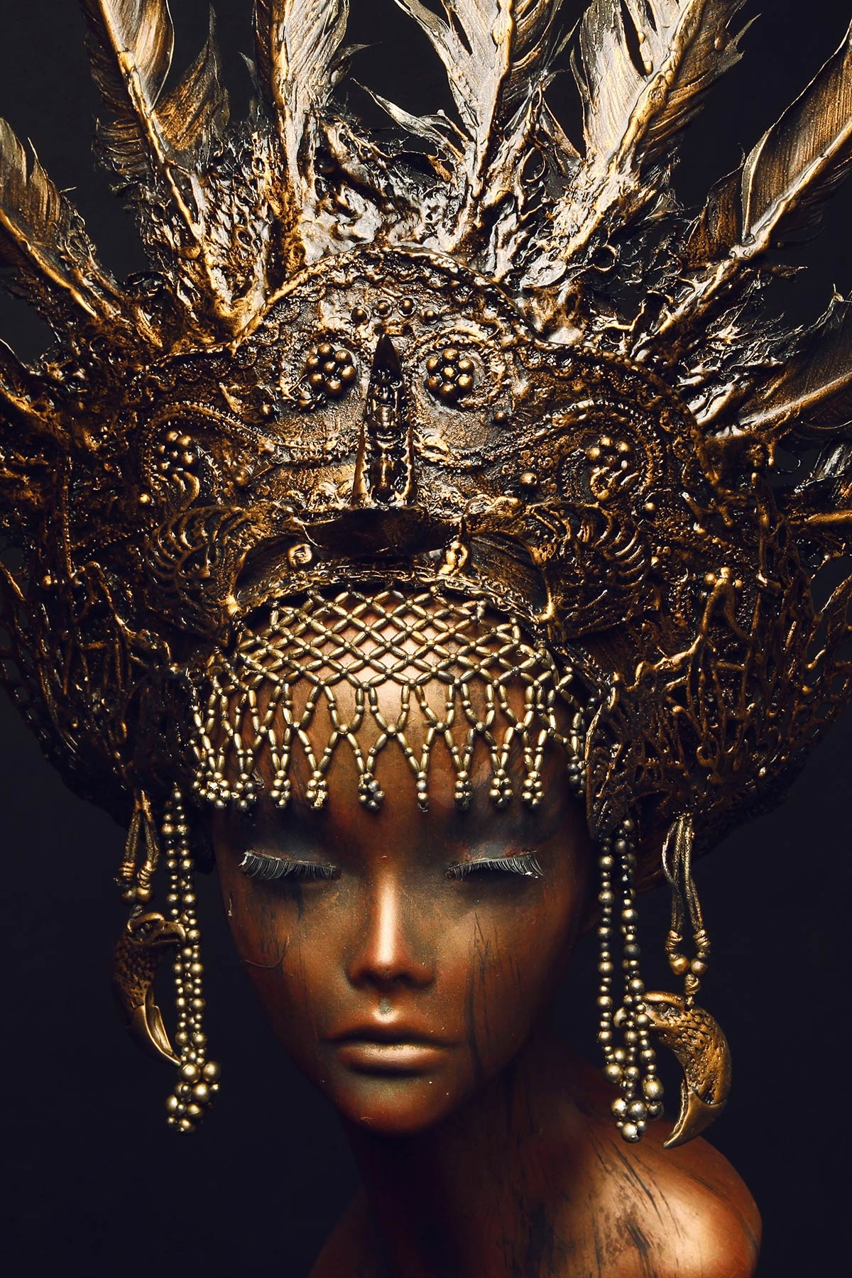 Bronze statue with head decoration